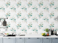 Botanical green wallpaper in a kitchen setting above a white countertop