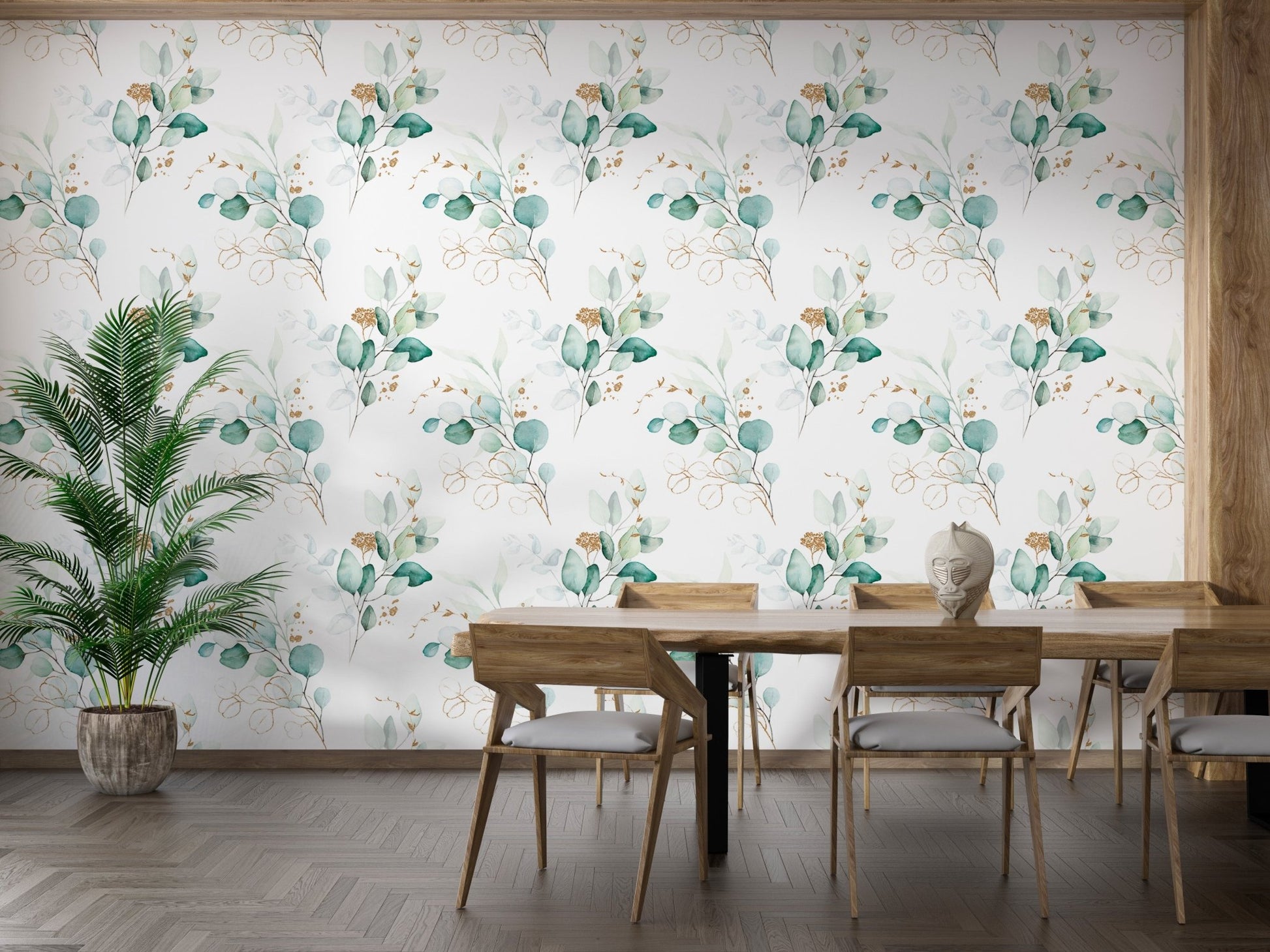 Watercolor eucalyptus wallpaper in a dining room with a large green plant