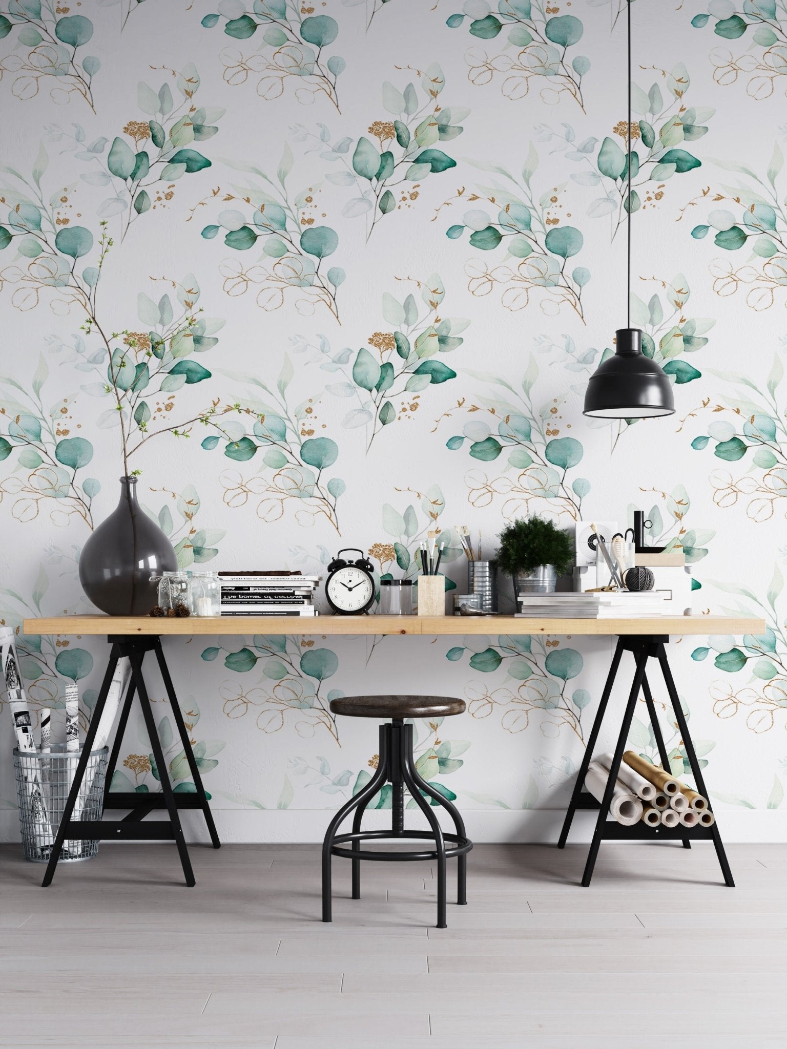 Eucalyptus branch wallpaper in a home office with a black desk and industrial stool
