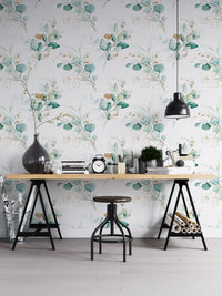 Eucalyptus branch wallpaper in a home office with a black desk and industrial stool