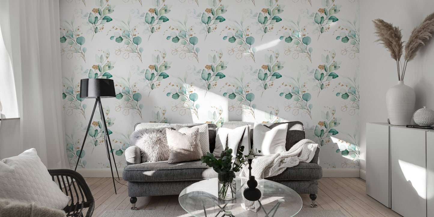 Green botanical wallpaper in a living room with a grey sofa and floor lamp