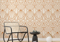 Geometric repeat pattern wallpaper behind a black wicker chair and side table.