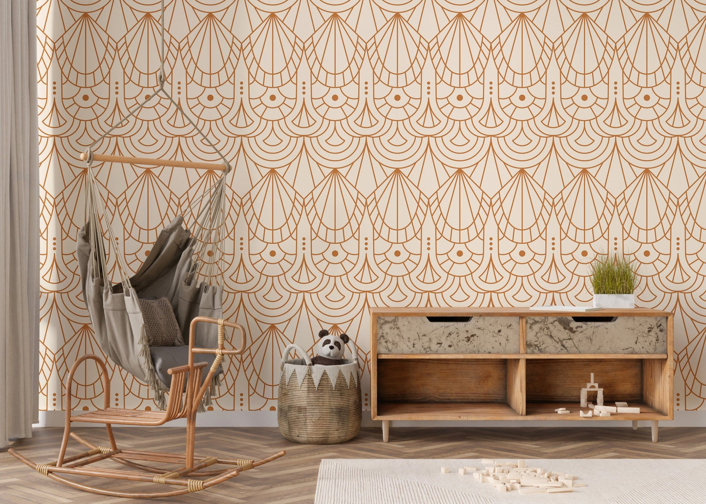 Geometric pattern wallpaper in a nursery area featuring a hanging wicker chair.
