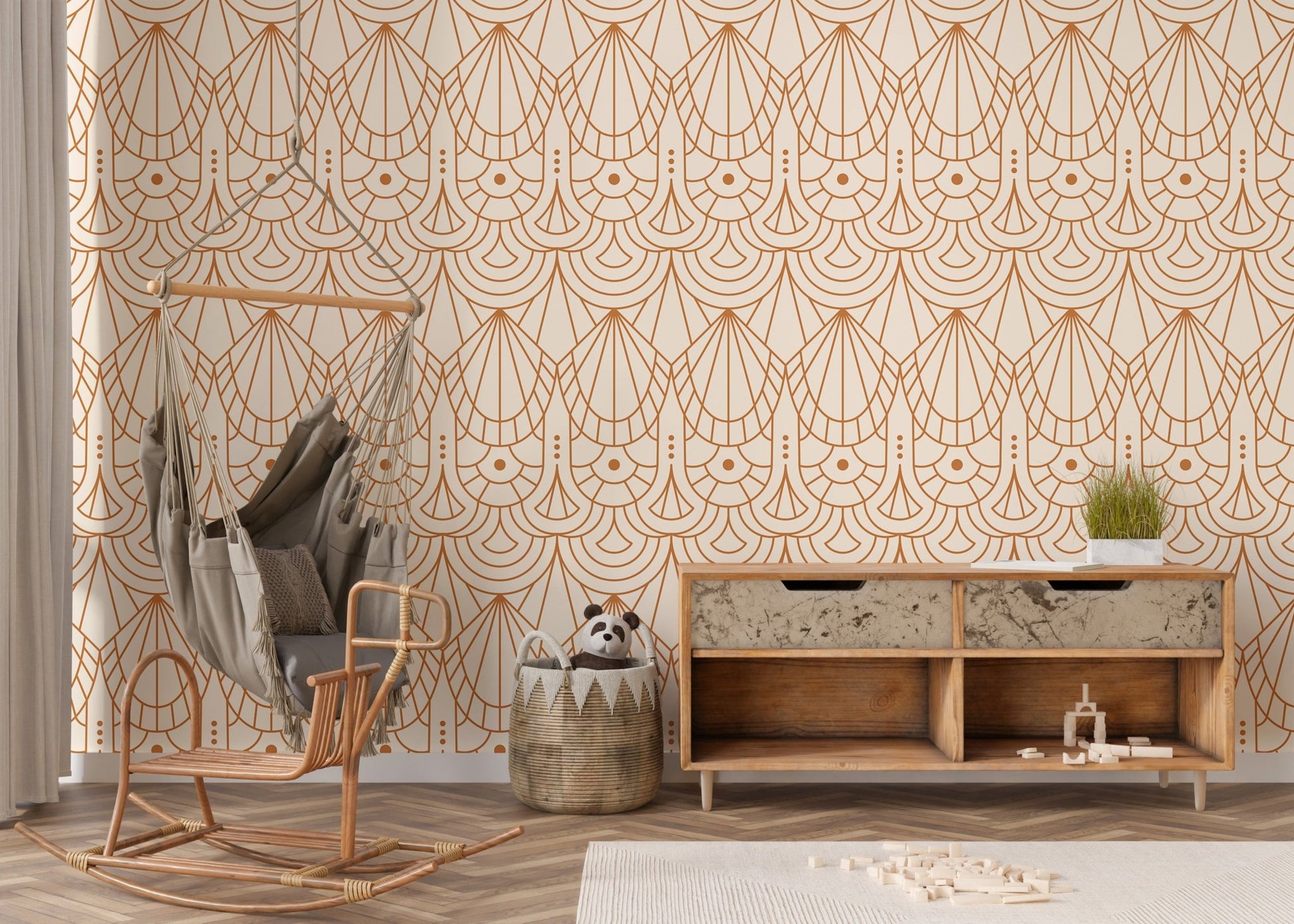 Geometric pattern wallpaper in a nursery area featuring a hanging wicker chair.