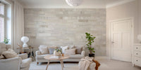 Realistic brickwork wall mural in a living room with a beige sofa.