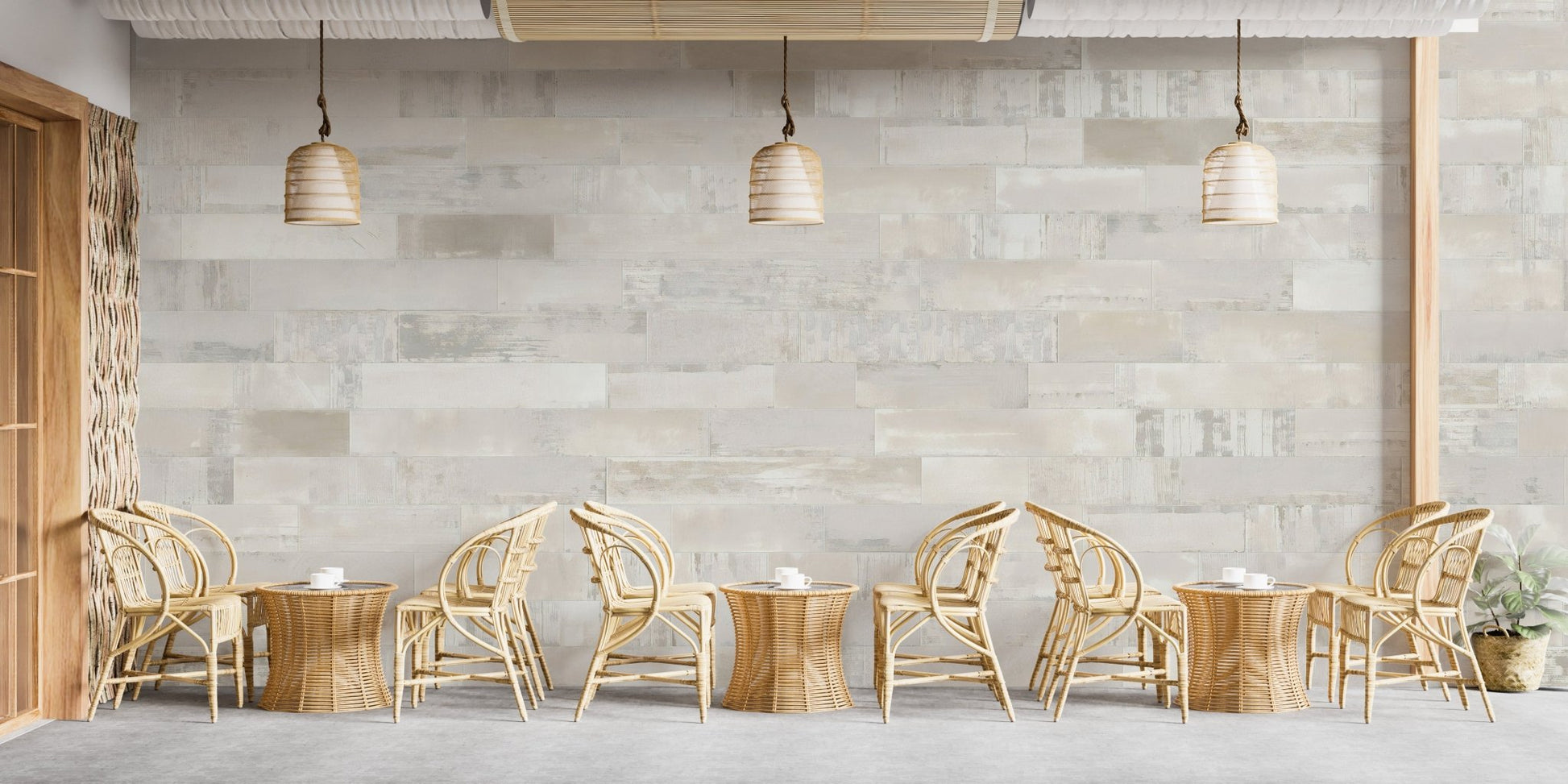 Rustic brick-inspired wall mural in cafe with tables and chairs.