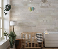 Detailed brick pattern mural creating a cozy and warm aesthetic in nursery.