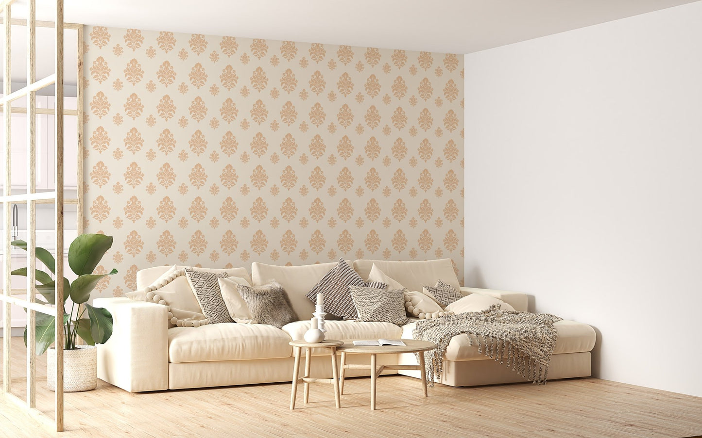 Beige classical damask repeat pattern wallpaper in a living space with a cream sofa.