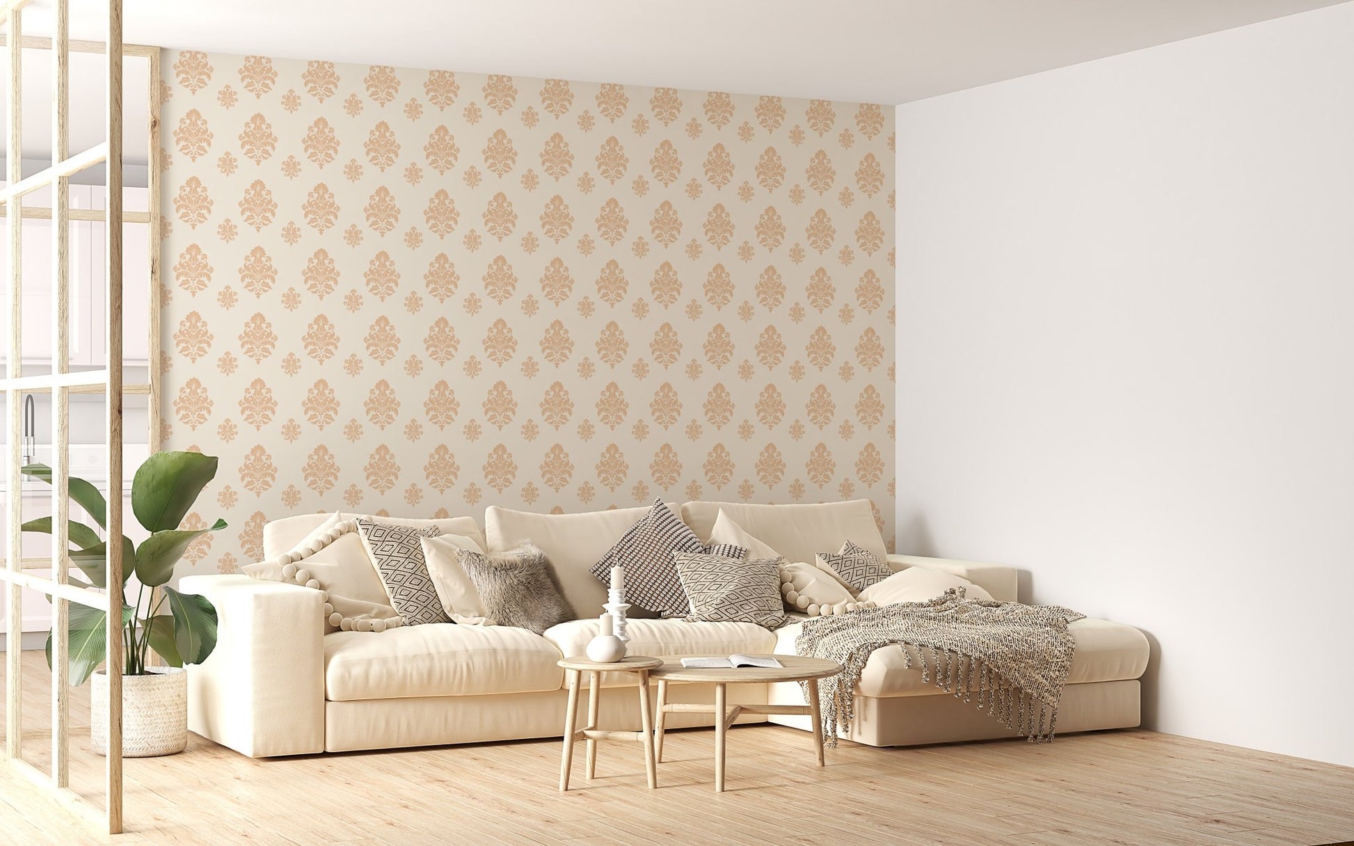 Beige classical damask repeat pattern wallpaper in a living space with a cream sofa.