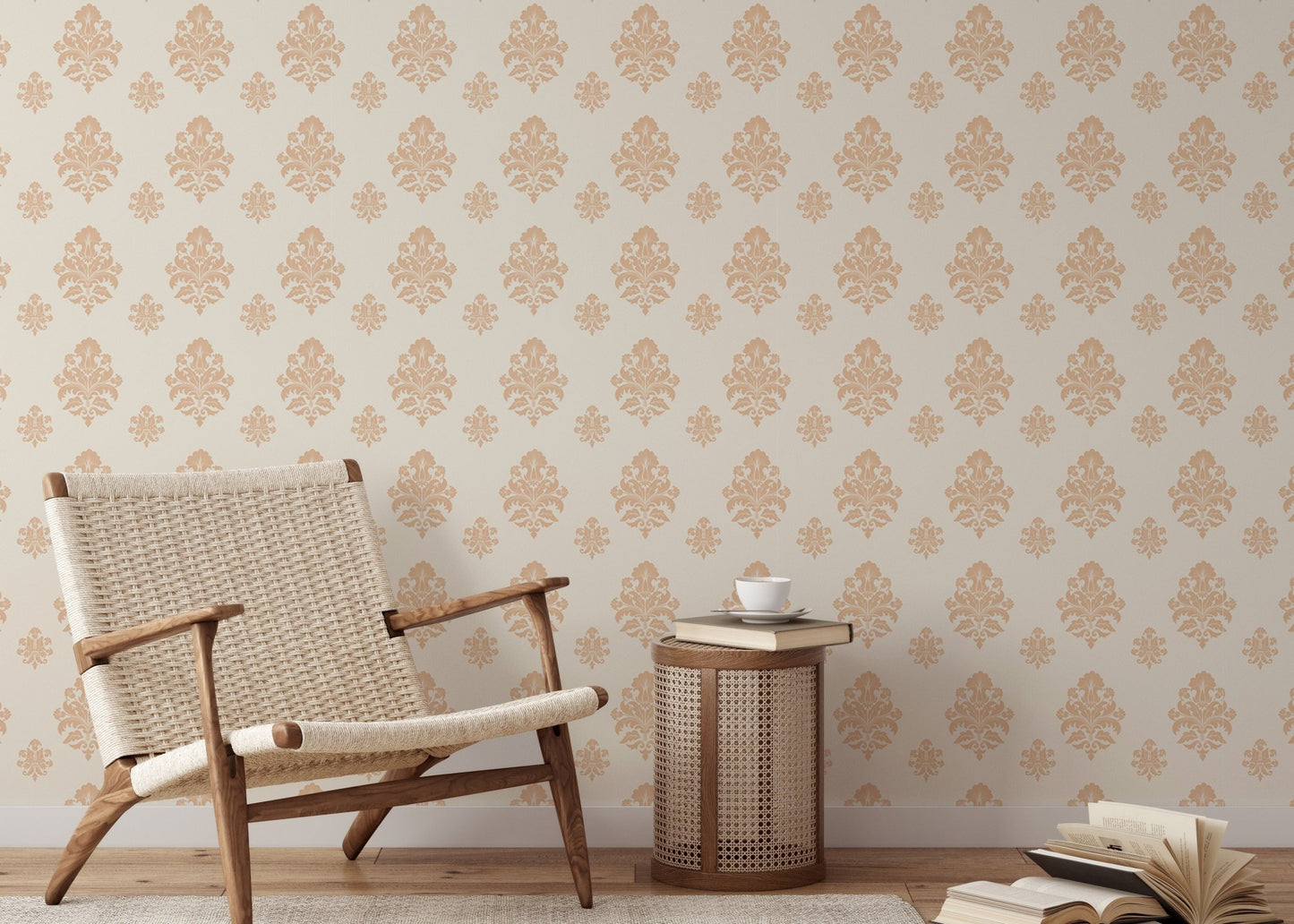 Classical damask wallpaper in a reading area with a woven chair and wooden side table.