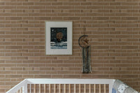 Subtle beige brick pattern for adhesive wallpaper in kids room.