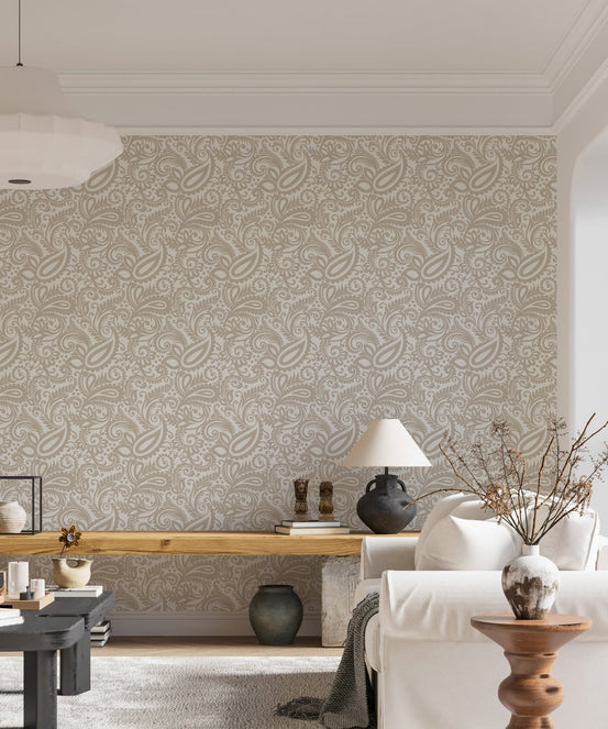 Swirled leaves pattern wallpaper applied to a spacious living room wall.
