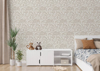Neutral tone paisley wallpaper in a modern bedroom with white furniture.