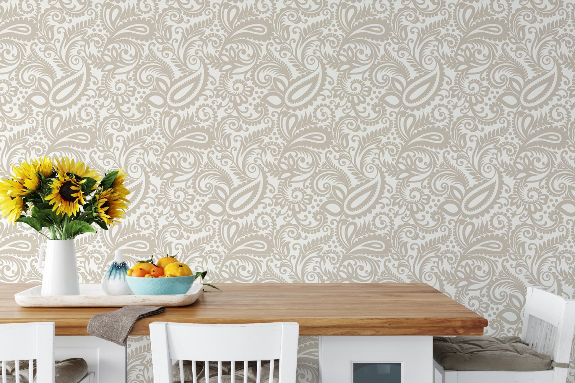 Beige color middle eastern paisleys swirled leaves wallpaper behind a dining table.