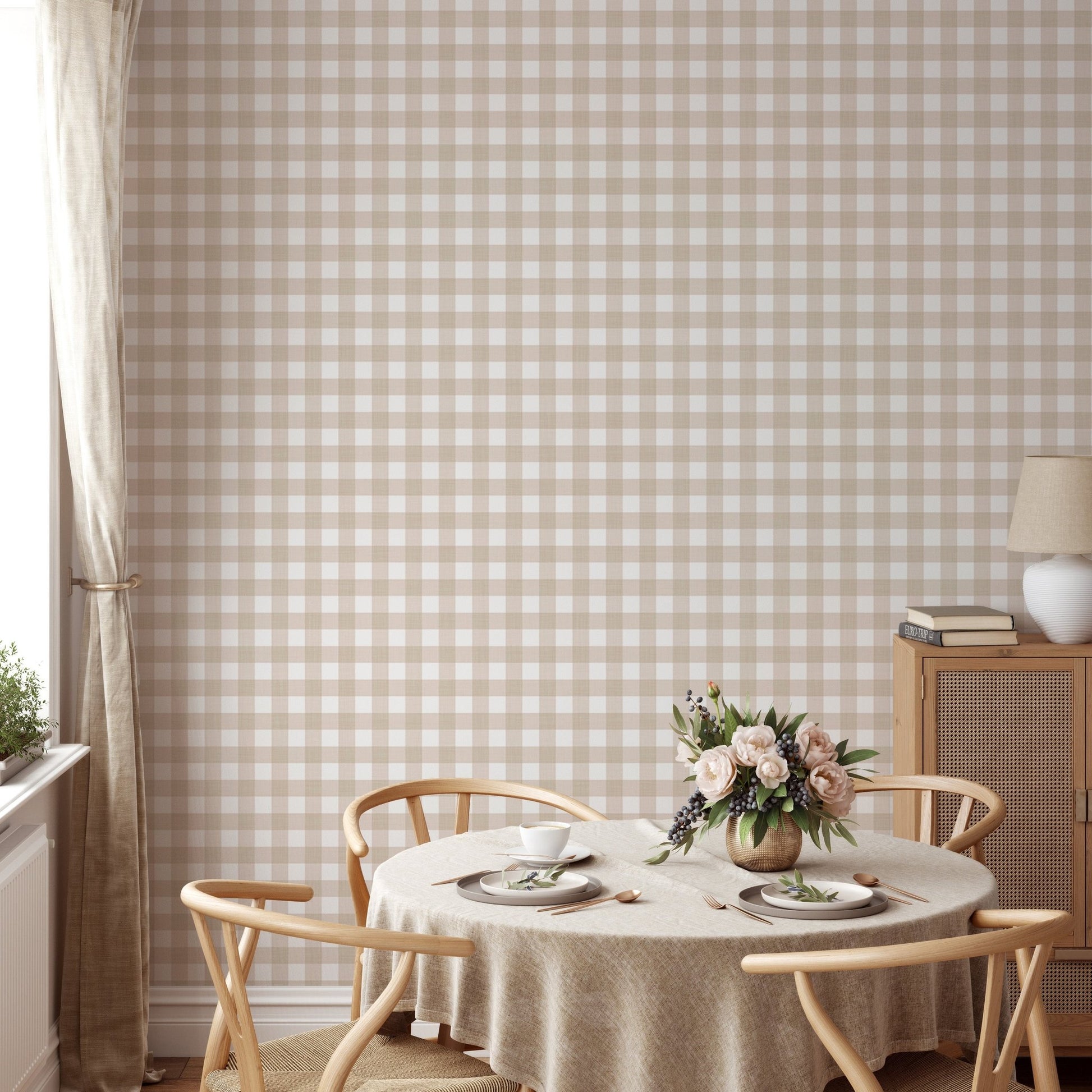Dining room featuring a round table and beige checkered stripe wallpaper on a feature wall.