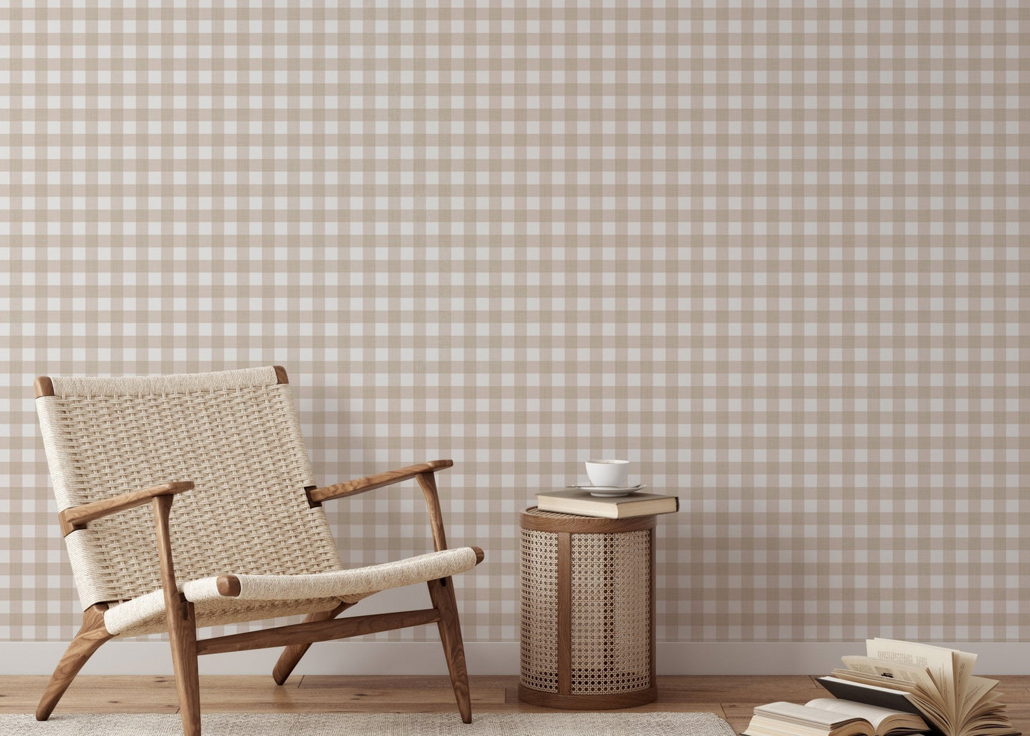 Reading nook with a wicker chair and beige scozzese stripe wallpaper.