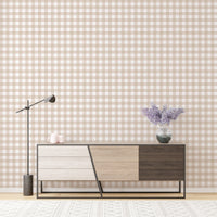 Modern sideboard against a beige color scozzese shabby stripe wallpaper backdrop.