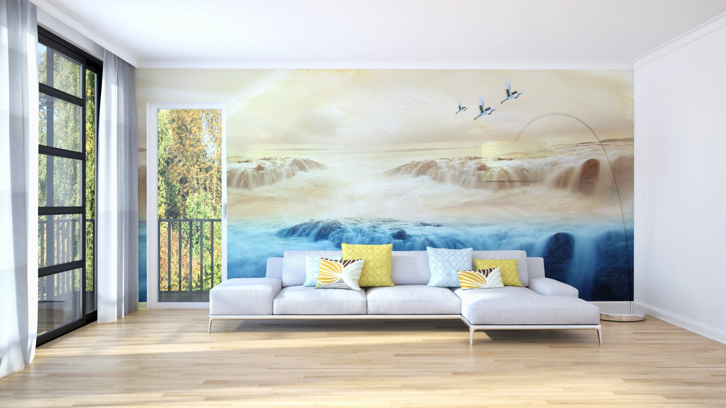 Soft toned waterfall wallpaper with cranes over misty water horizon.