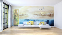 Soft toned waterfall wallpaper with cranes over misty water horizon.