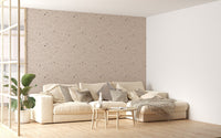 Large scale stone pattern wallpaper behind modern cream sofa.
