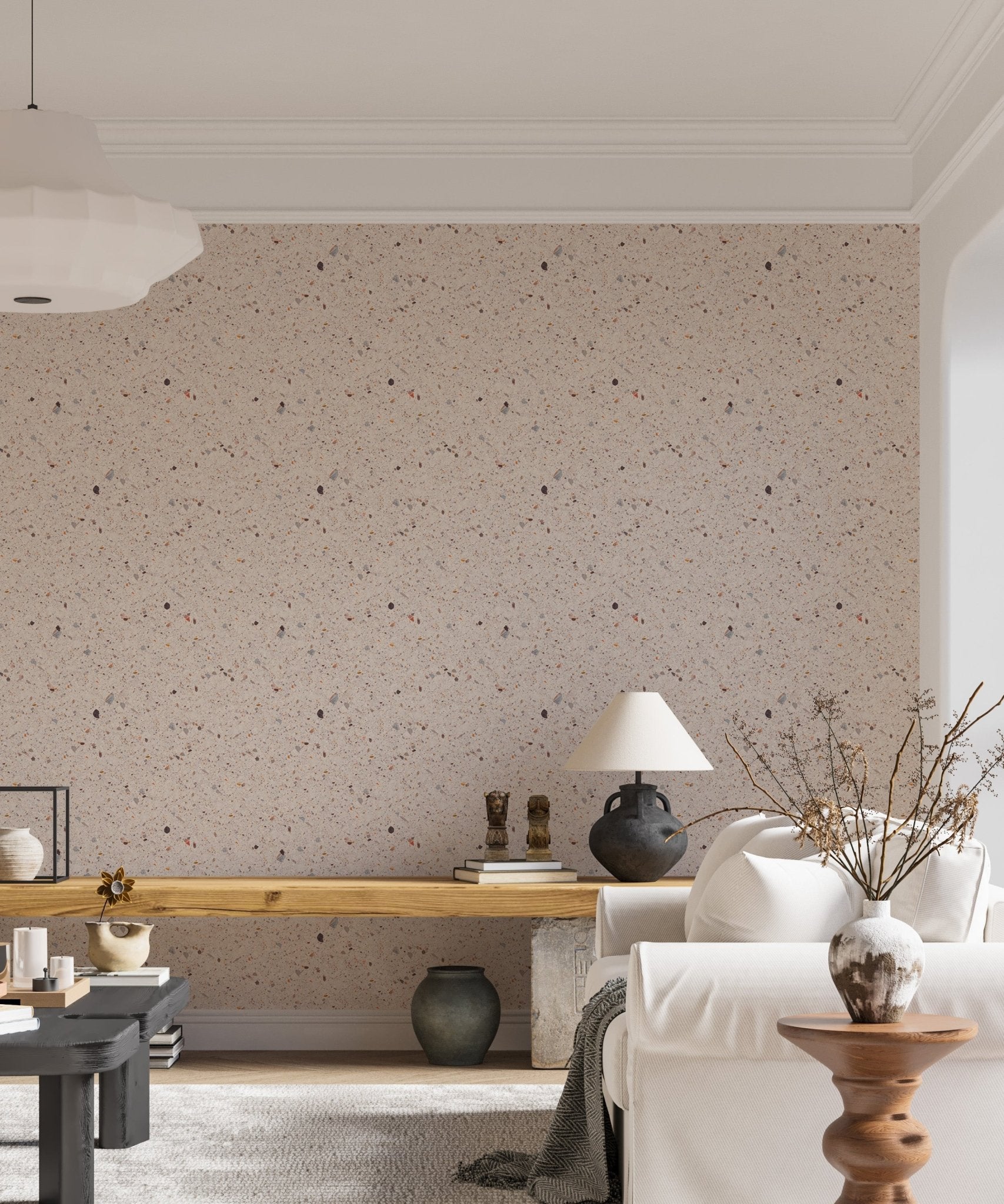 Stone effect wallpaper in living room with wooden desk and white sofa.