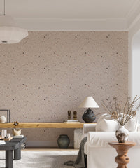 Stone effect wallpaper in living room with wooden desk and white sofa.
