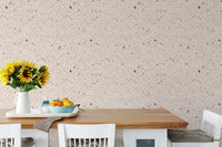 Dining area wallpaper with beige stone and white wooden table.