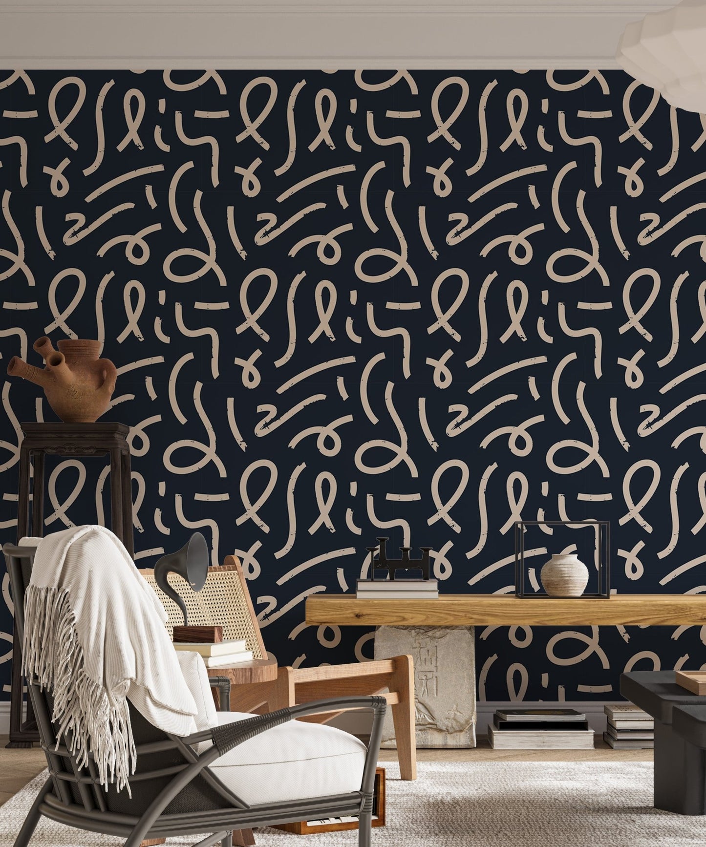 Abstract squiggle wallpaper in a home office setting with a seated person.
