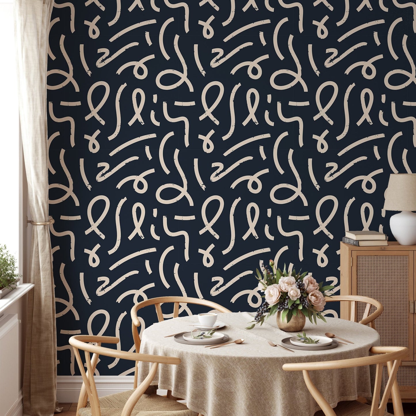 Black wallpaper with white lines in a dining room with a round table.