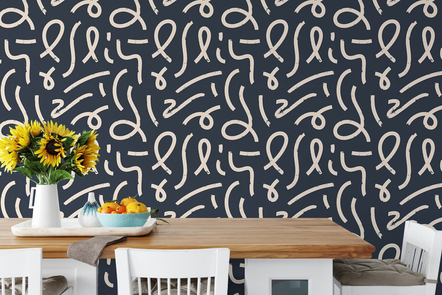 Minimalist abstract line art wallpaper in a dining area with a wooden table.
