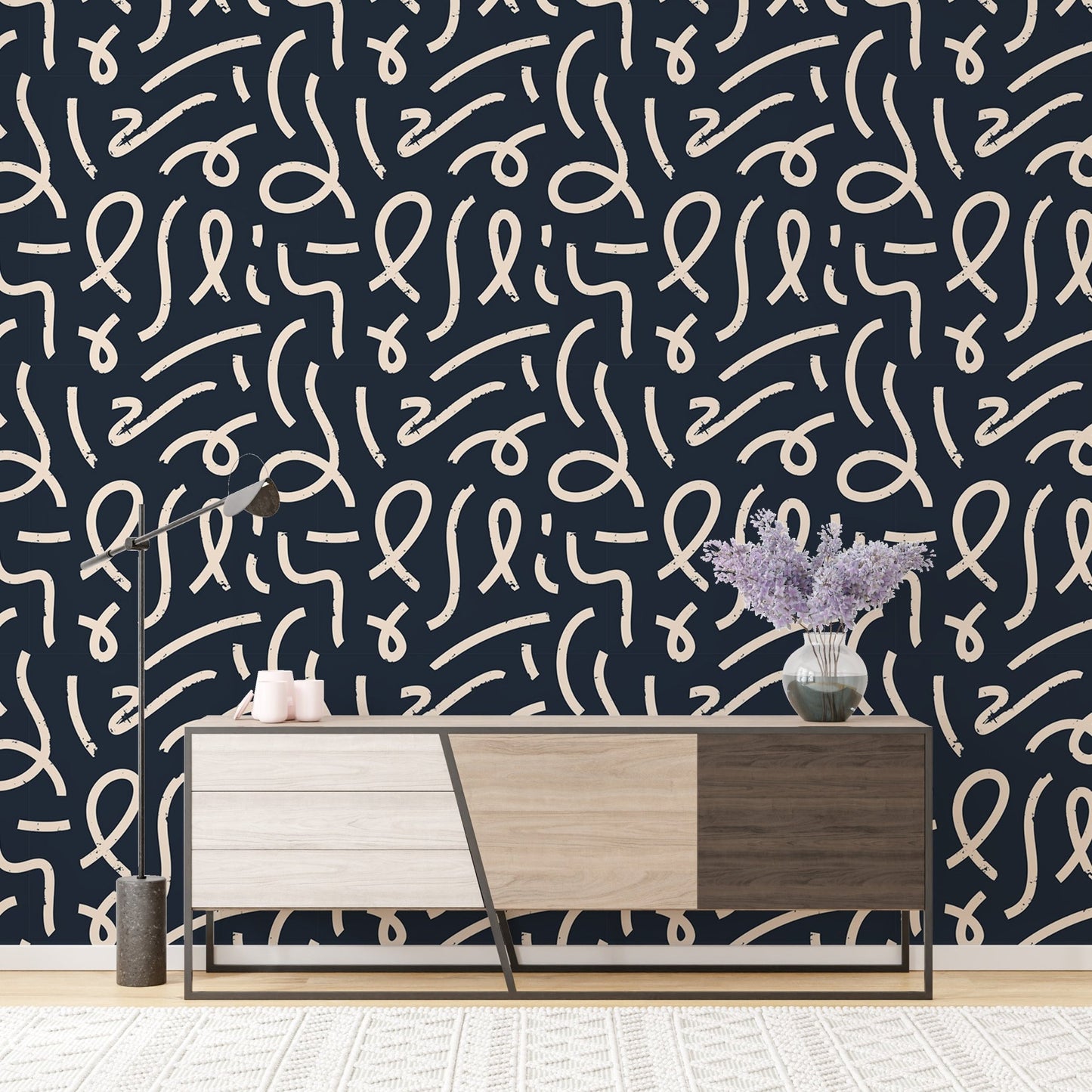 Minimalist brush stroke wallpaper behind a modern wooden sideboard.