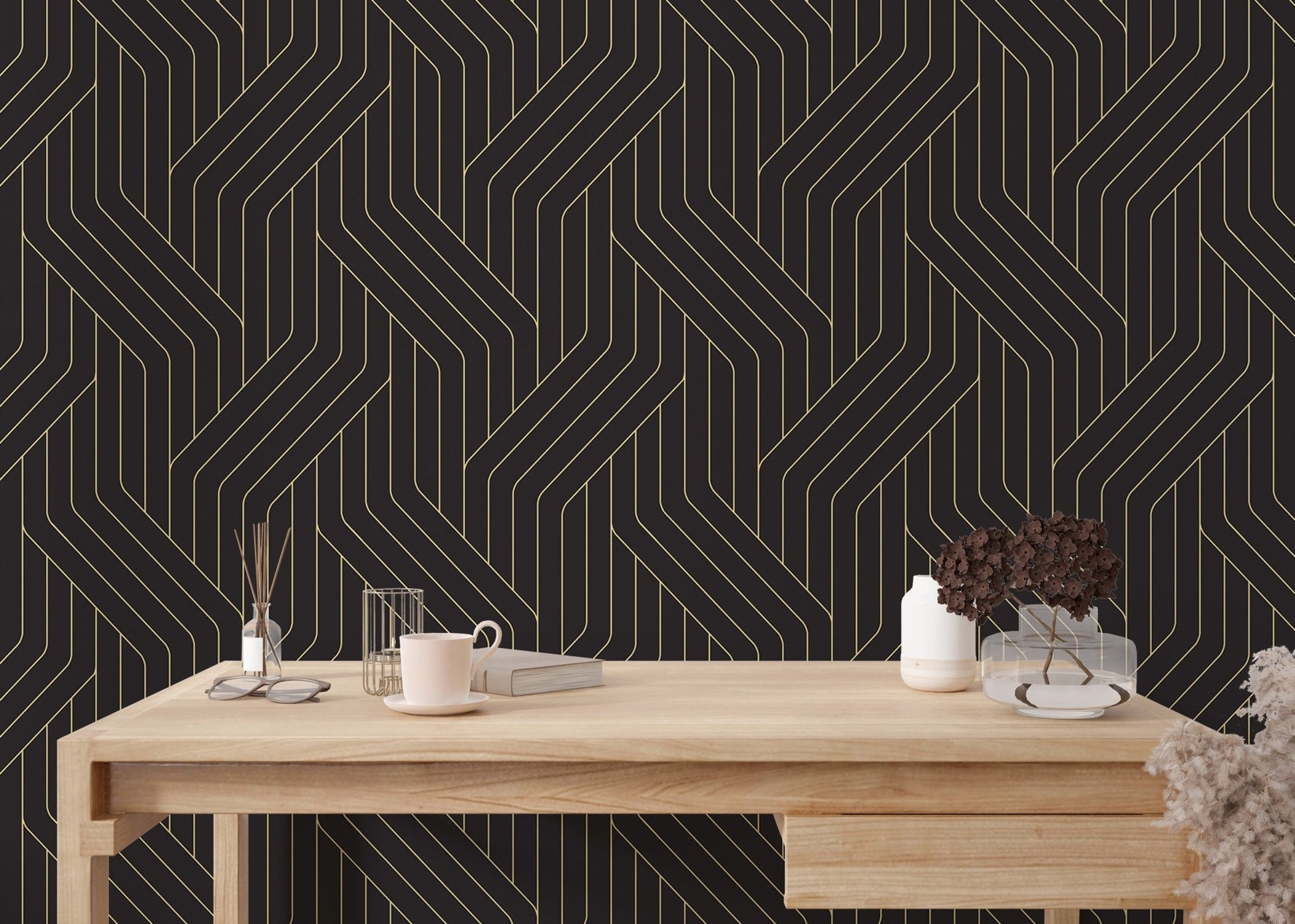Abstract gold line wallpaper in a home office with a light wood desk.