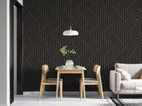 Dark grey wallpaper with gold linear patterns in a minimalist dining area.