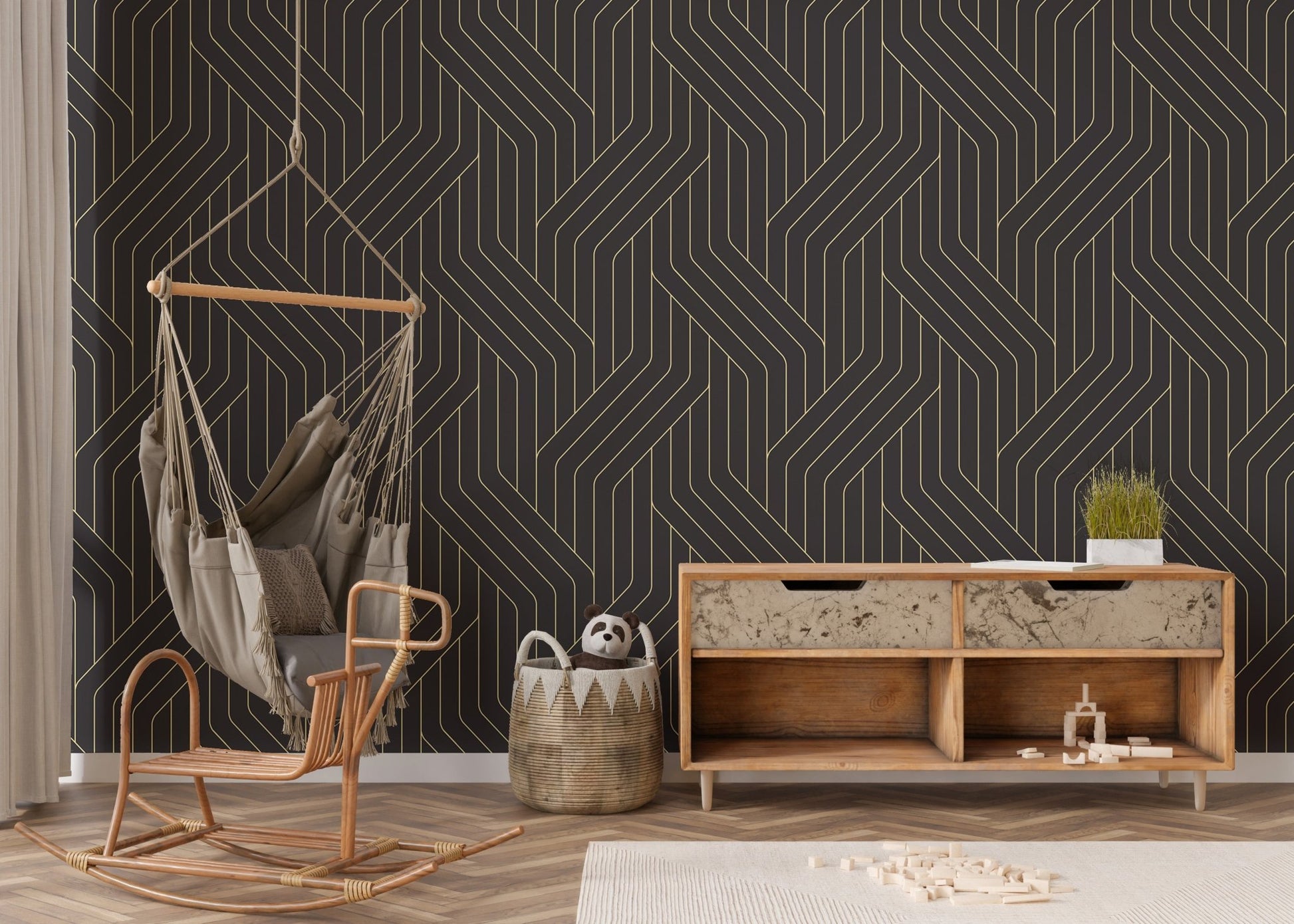 Gold and black ornate wallpaper with lines in nursery area.