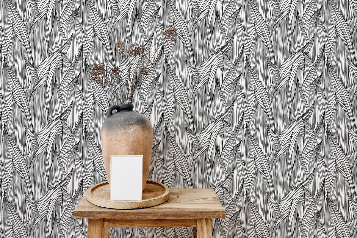 Abstract nature inspired wallpaper behind a wooden table with a large vase.
