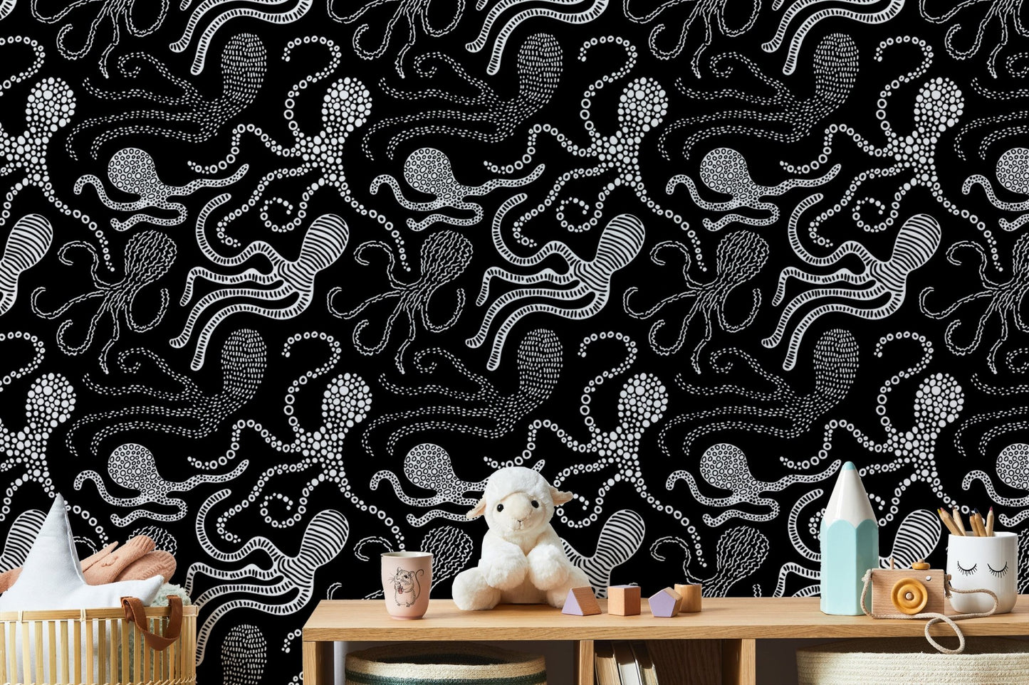 Black and white wallpaper with abstract octopus design in nursery.