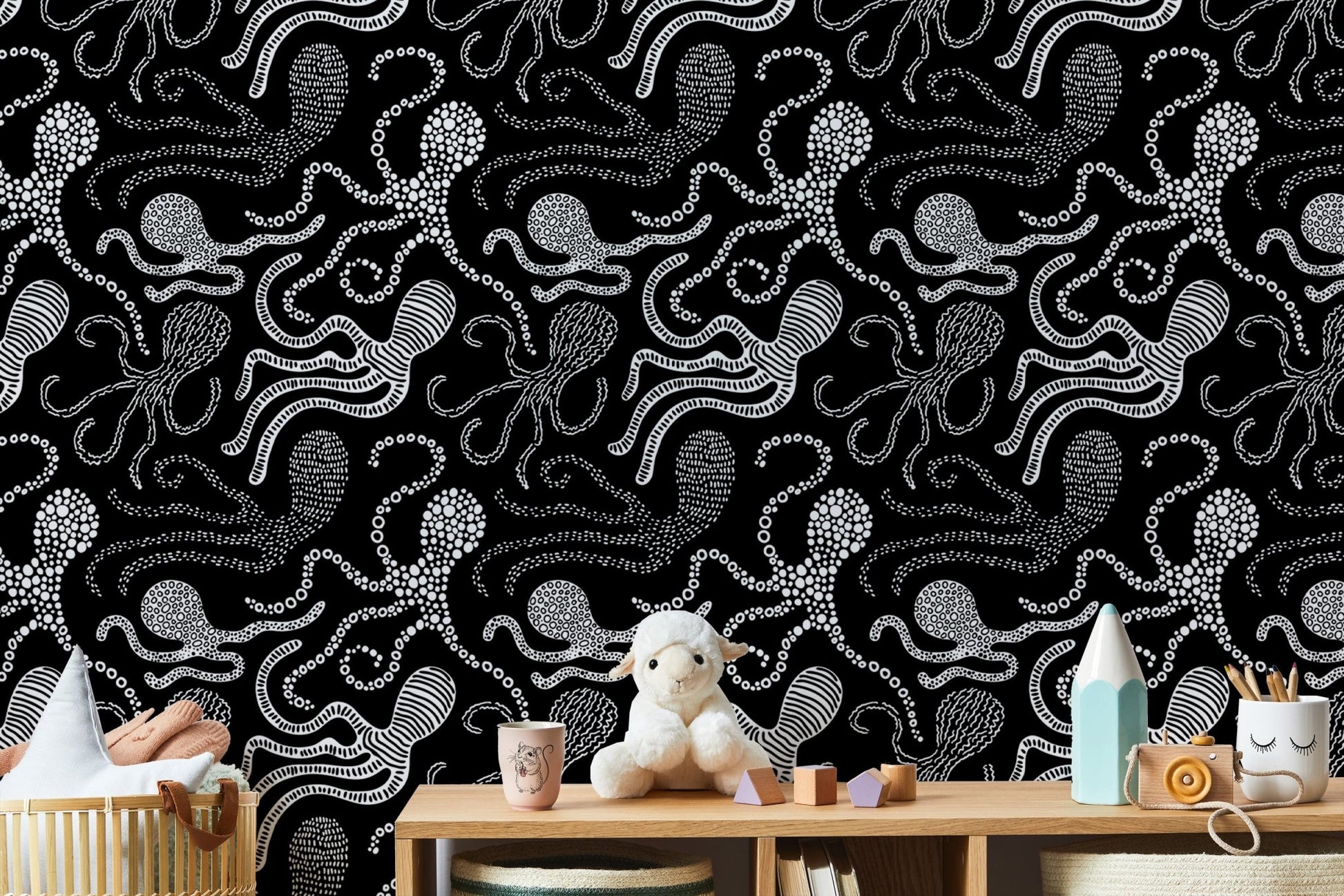 Black and white wallpaper with abstract octopus design in nursery.