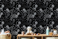 Black and white wallpaper with abstract octopus design in nursery.