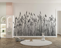 Monochrome reed canebrake wall mural behind a white crib in a modern nursery.