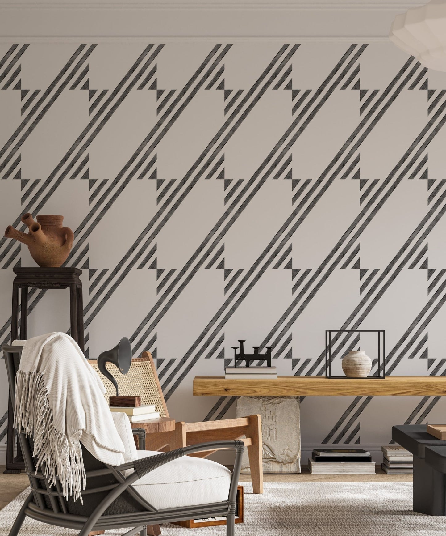 Interior lounge with a rocking chair and geometric stripe wallpaper design.