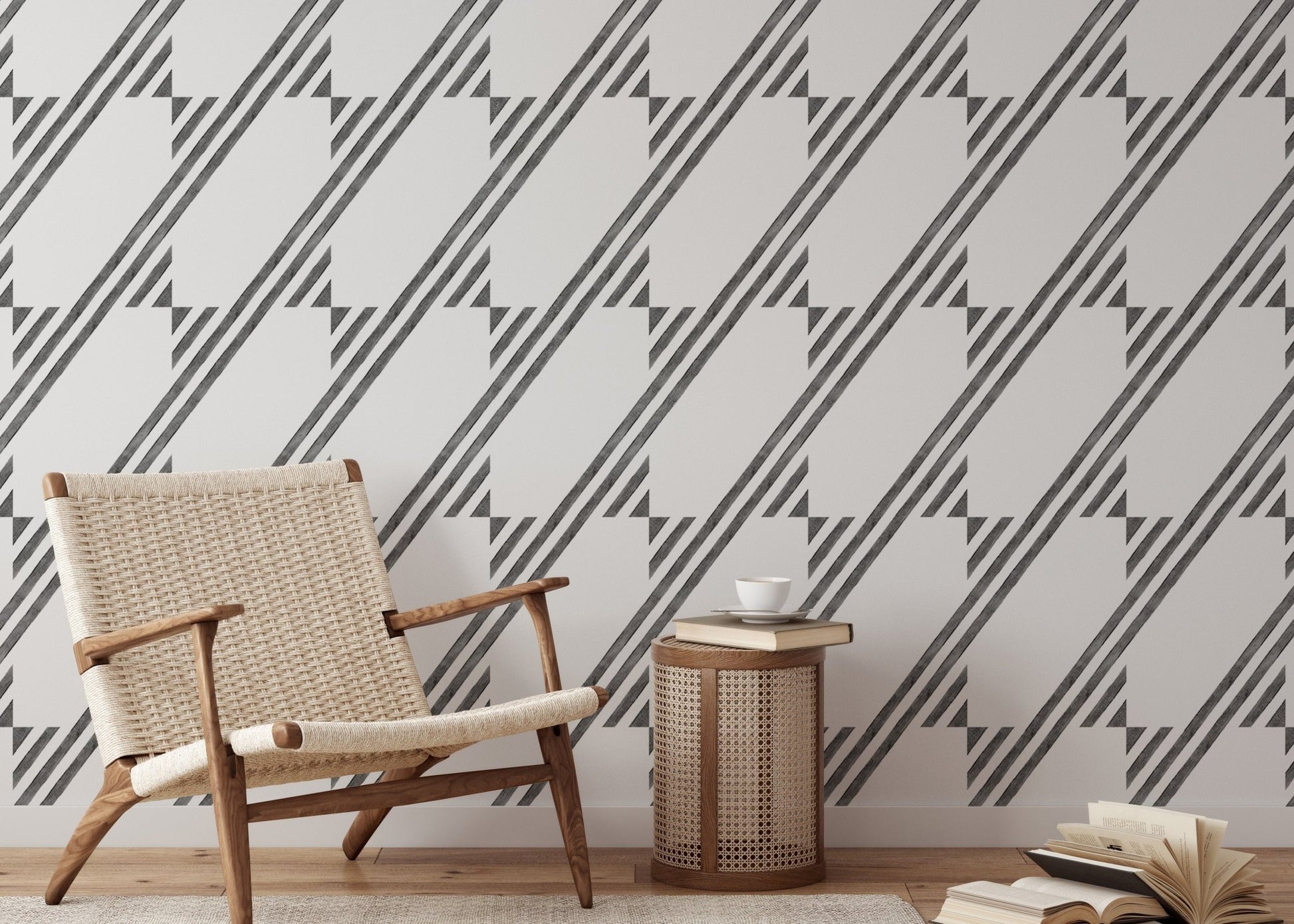Minimalist chair next to a black and white diagonal stripe wallpaper feature wall.