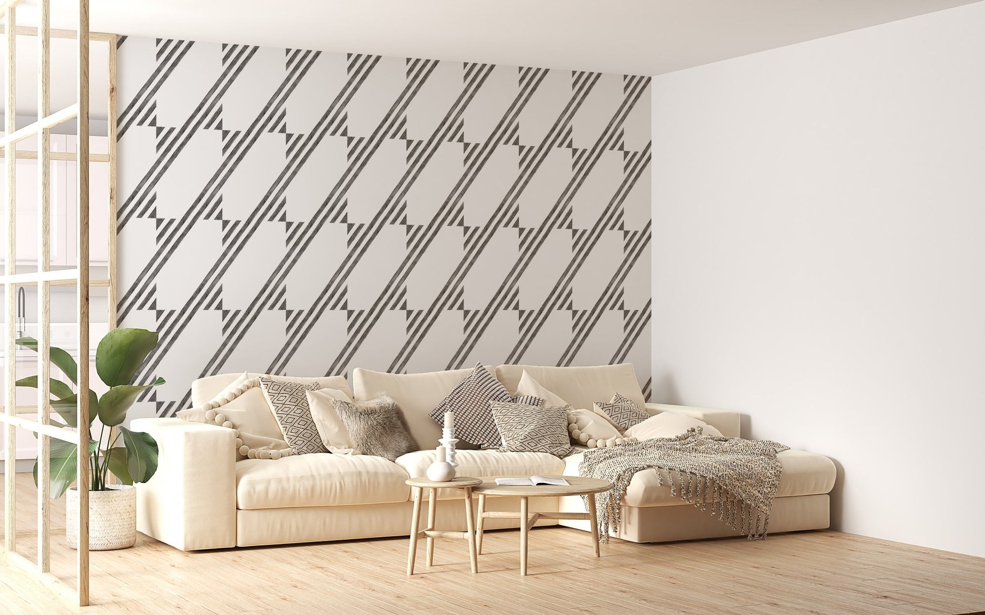 Large living space with a sofa and grey diagonal stripe wallpaper.