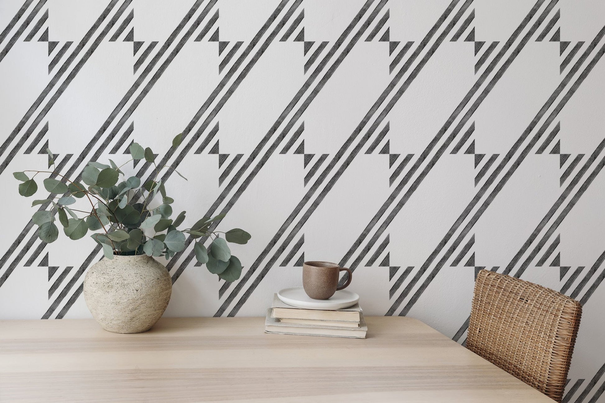 Dining area featuring a striped wallpaper and simple wooden furniture.