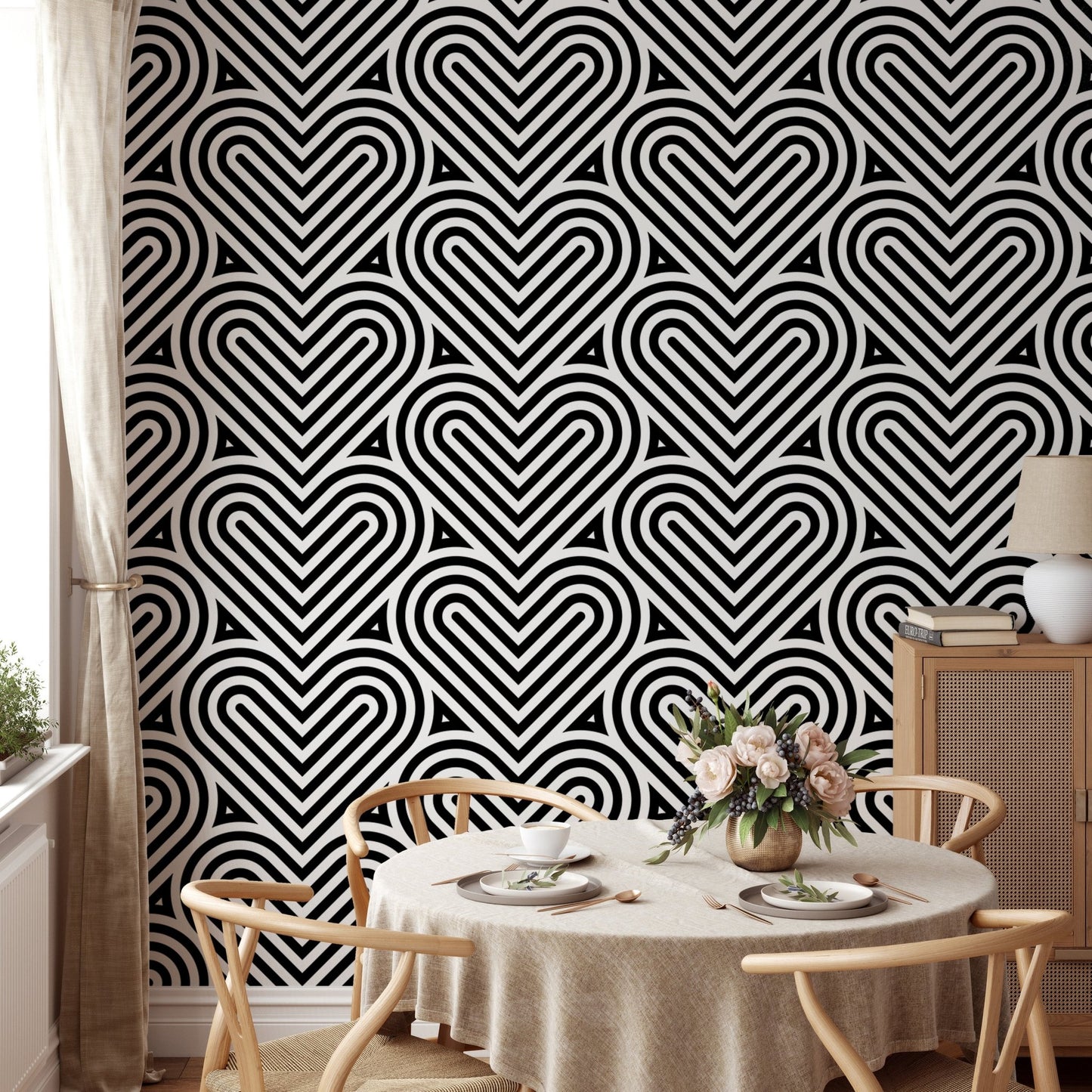 Repeating heart wallpaper in a dining room with a round wooden table.