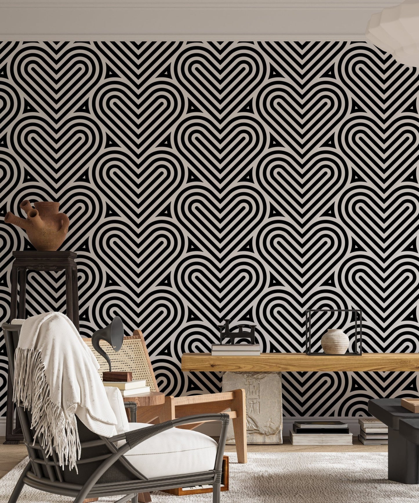 Black and white heart wallpaper in a living room with a grey chair.