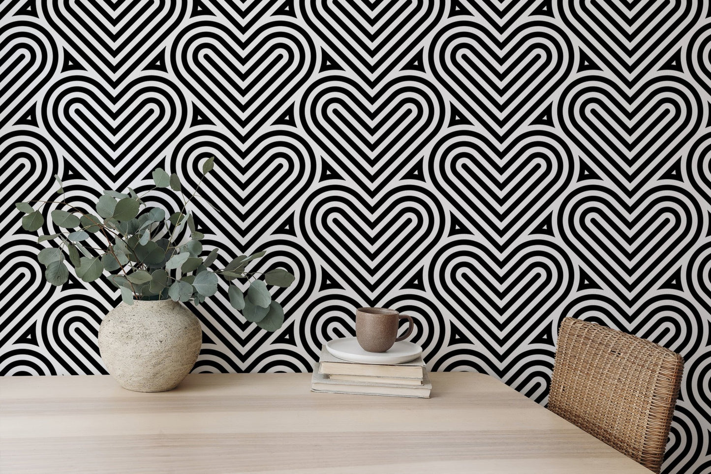 Linear heart pattern wallpaper in a workspace with a wooden desk and plant.