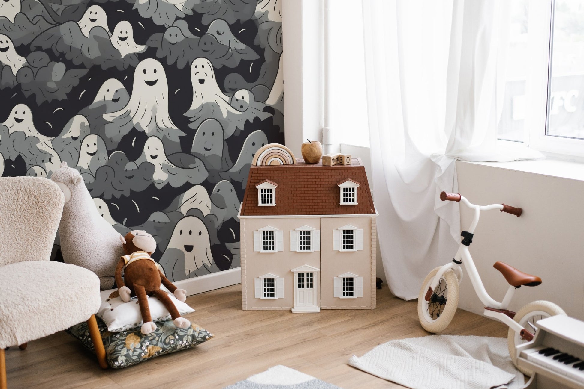 Whimsical Halloween wallpaper with floating ghost artwork.