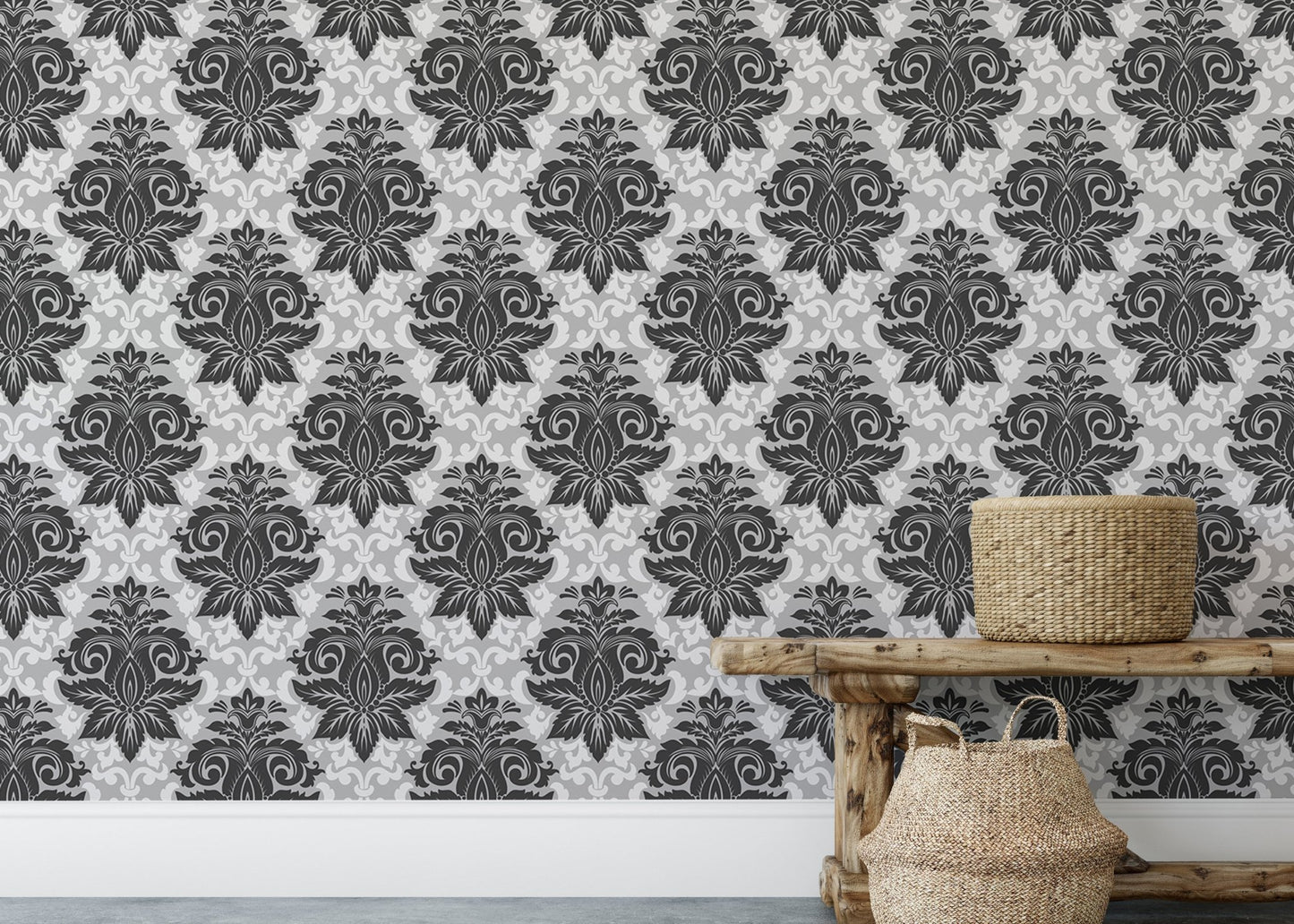 Symmetrical damask wallpaper on a feature wall above a low wooden bench.