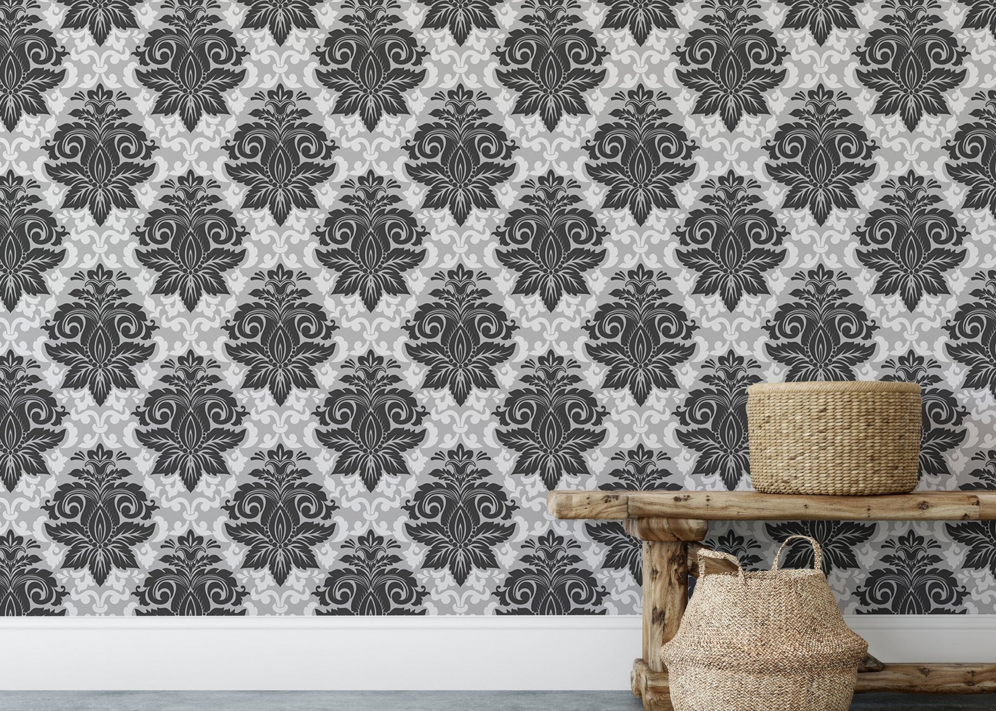 Symmetrical damask wallpaper on a feature wall above a low wooden bench.