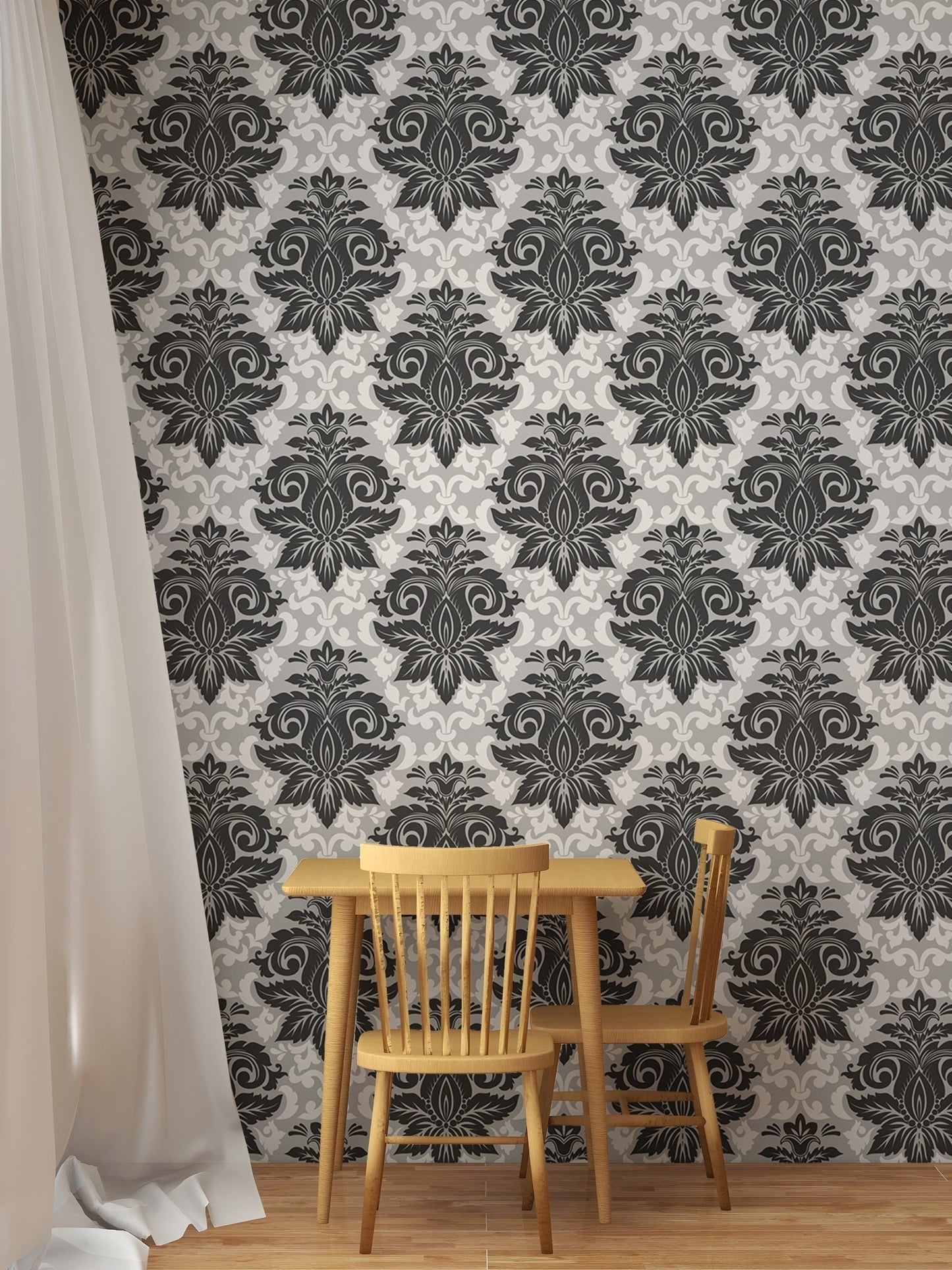 Greyish damask wallpaper behind a small wooden dining set and white curtain.